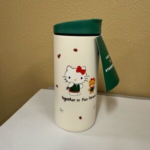 Starbucks Cream Tumbler with Green Lid and Hello Kitty Design 2025
